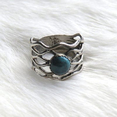 Zilveren gevlochten ring blauw steentje